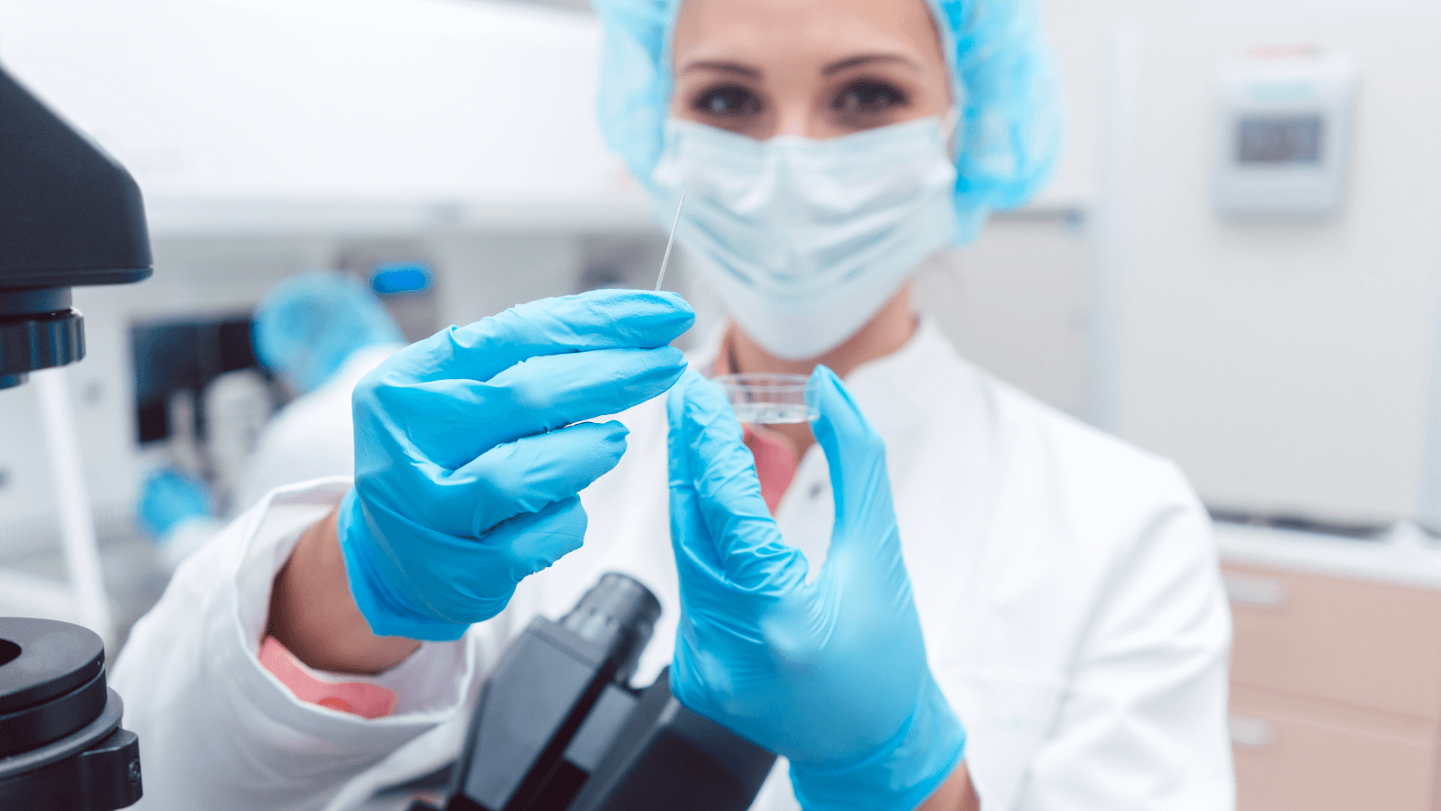 Scientist in Laboratory with Fertilized Egg Cell