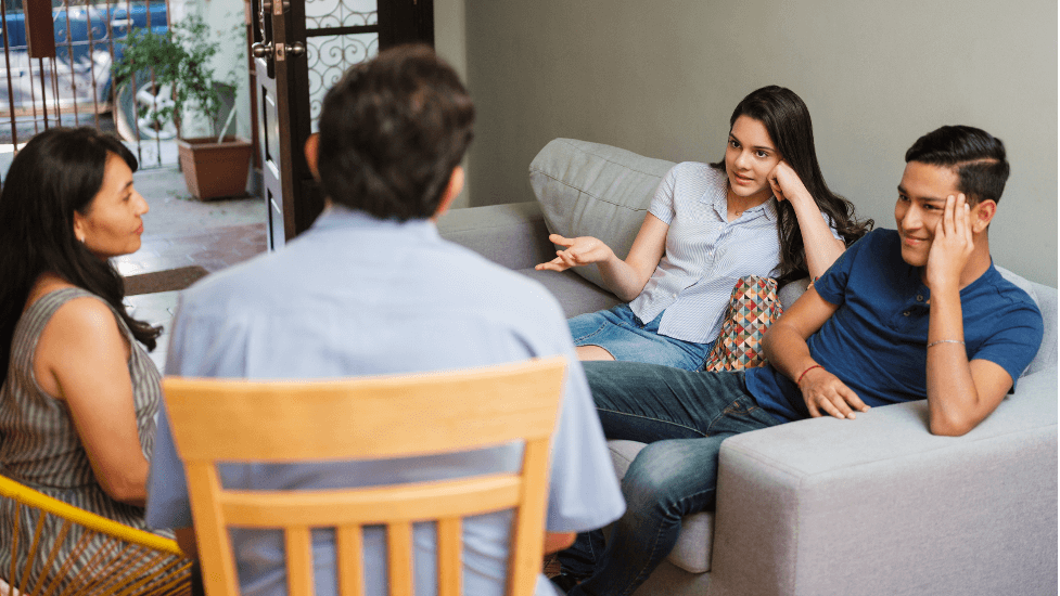 Couple Conversing with Family About IVF