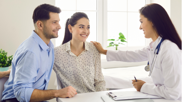 Couple Conversing with Doctor About the Benefits of Genomics in IVF