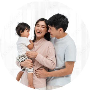 Happy couple holding their baby