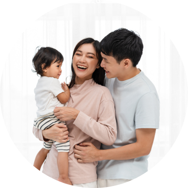 Happy couple holding their baby