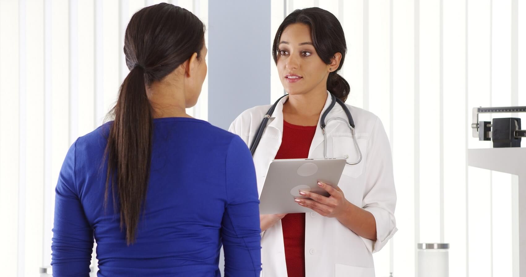 • Compassionate fertility specialist explaining donation requirements to donor candidate